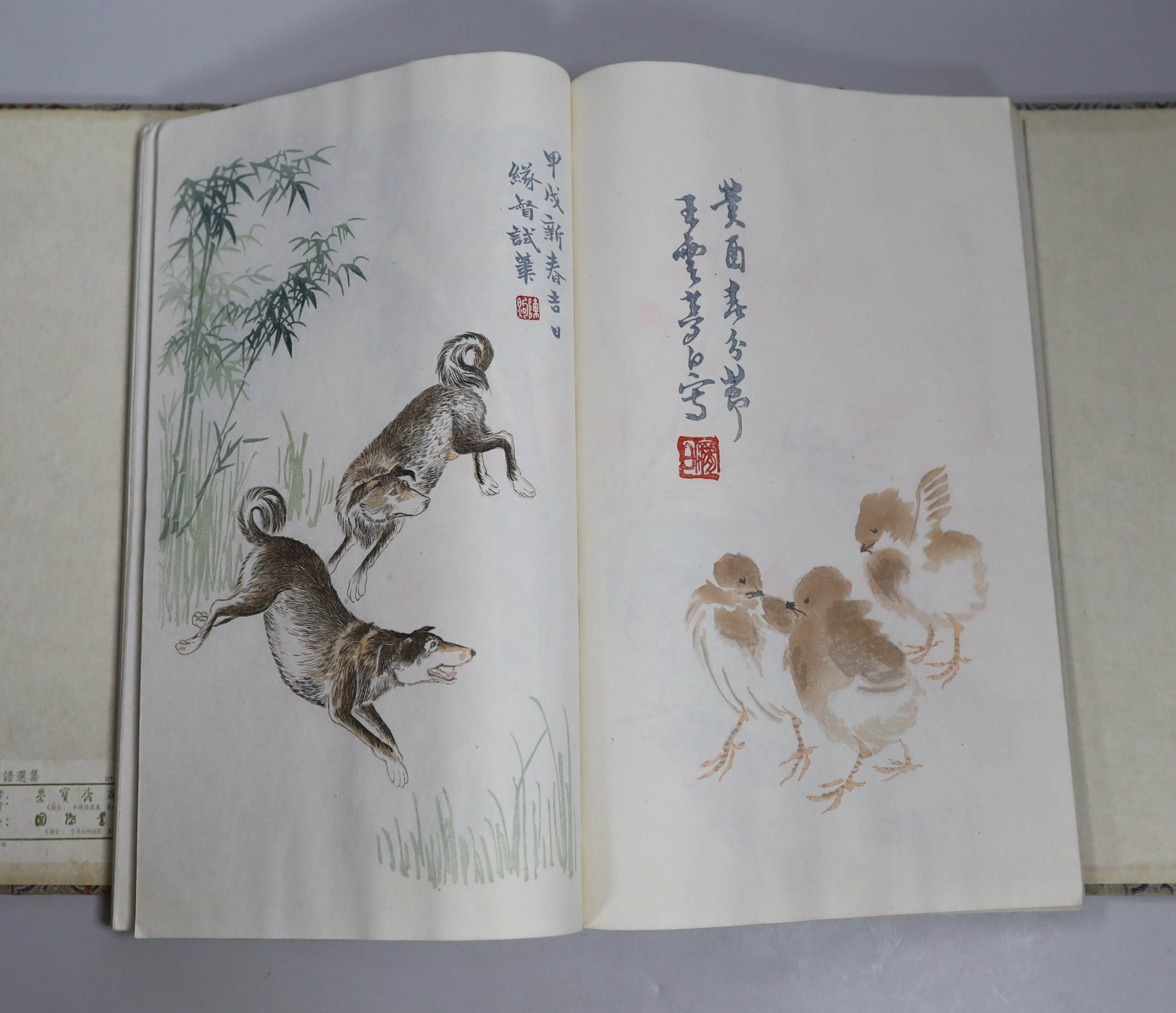 A Chinese book of woodblock prints of works by famous artists including Qi Baishi, published by Rongbao Ji, Beijing 1952